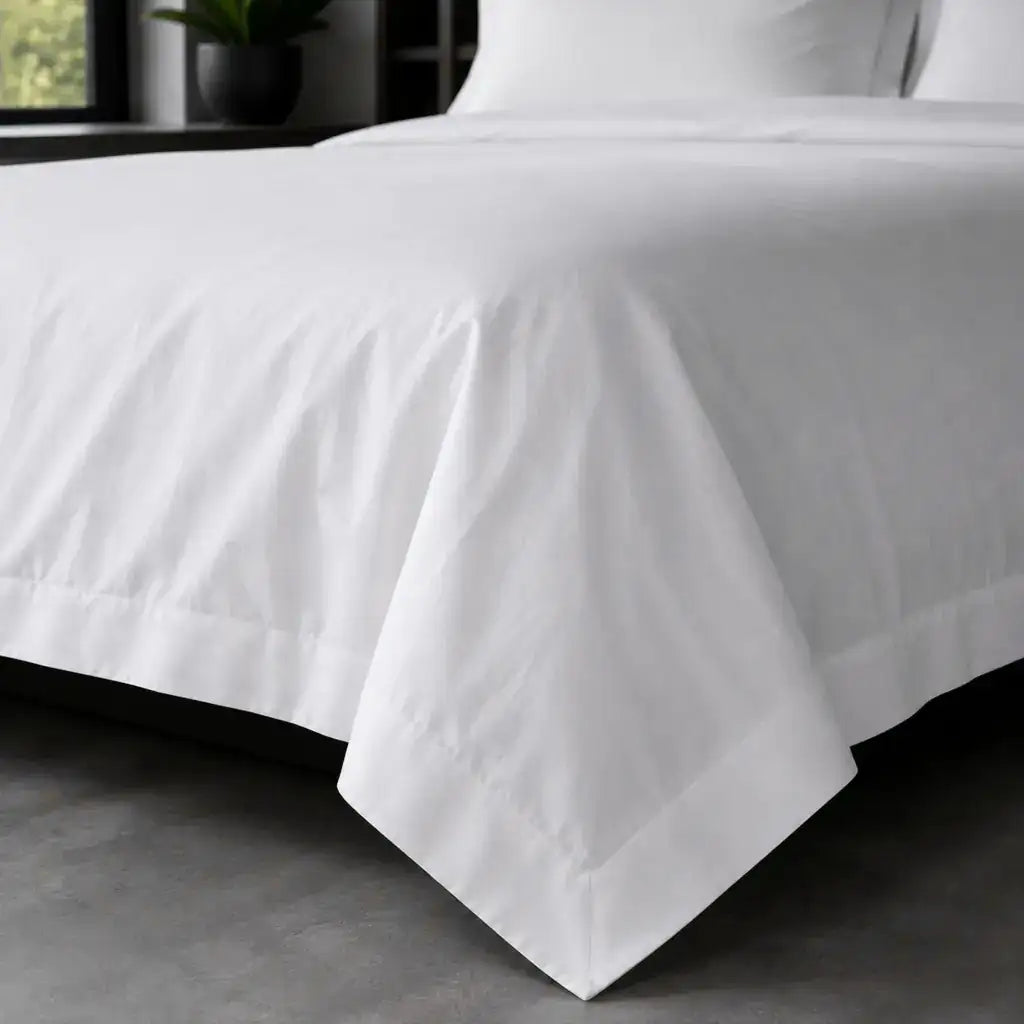 White polycotton percale Oxford duvet cover set, no satin stitch – on-bed view | Linen & Co