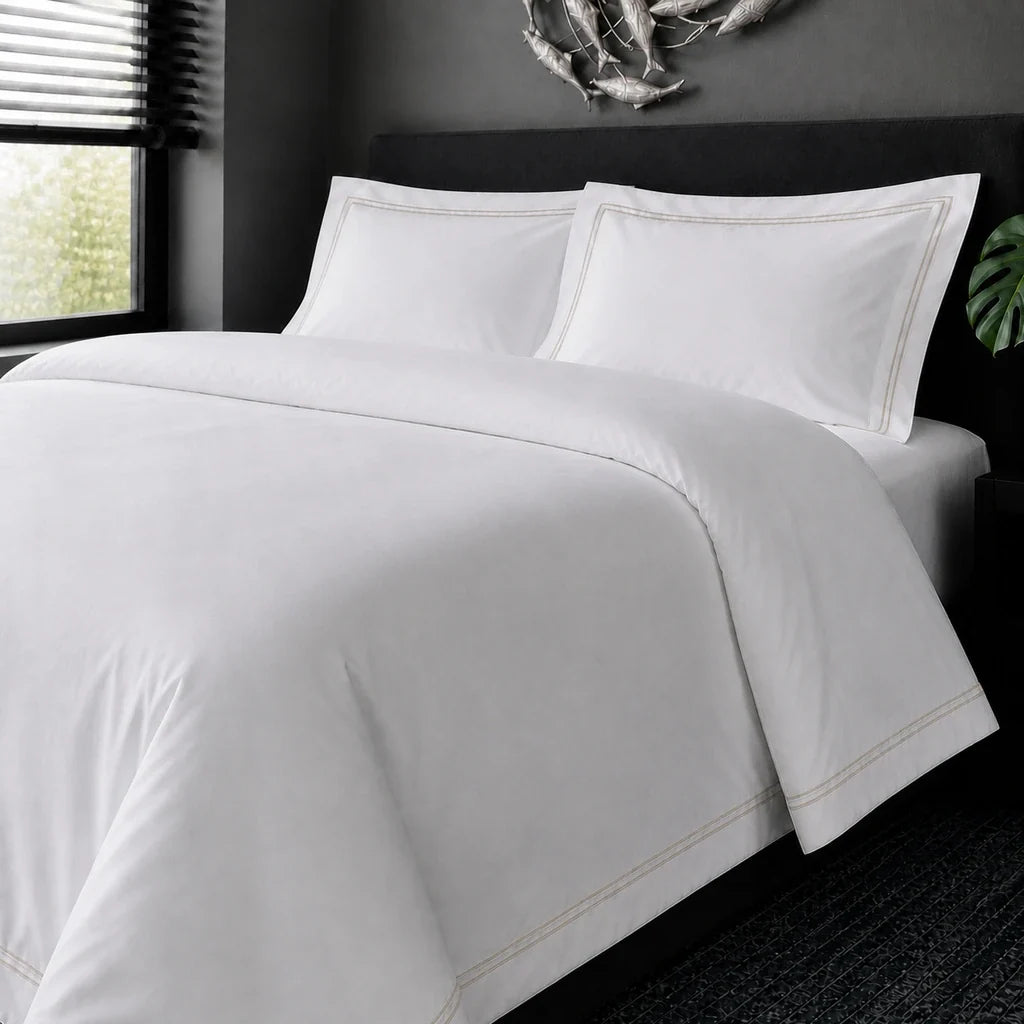 White cotton 200TC Oxford duvet cover set with stone two-row satin stitch – on-bed view | Linen & Co