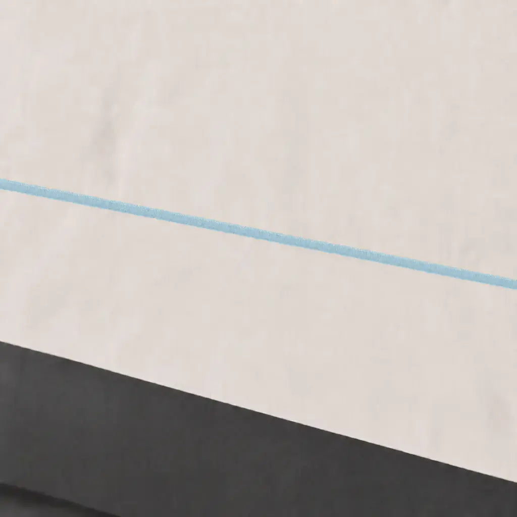Close-up of cream polycotton percale 200TC Oxford cuff with Duck Egg one-row satin stitch - Linen and Co