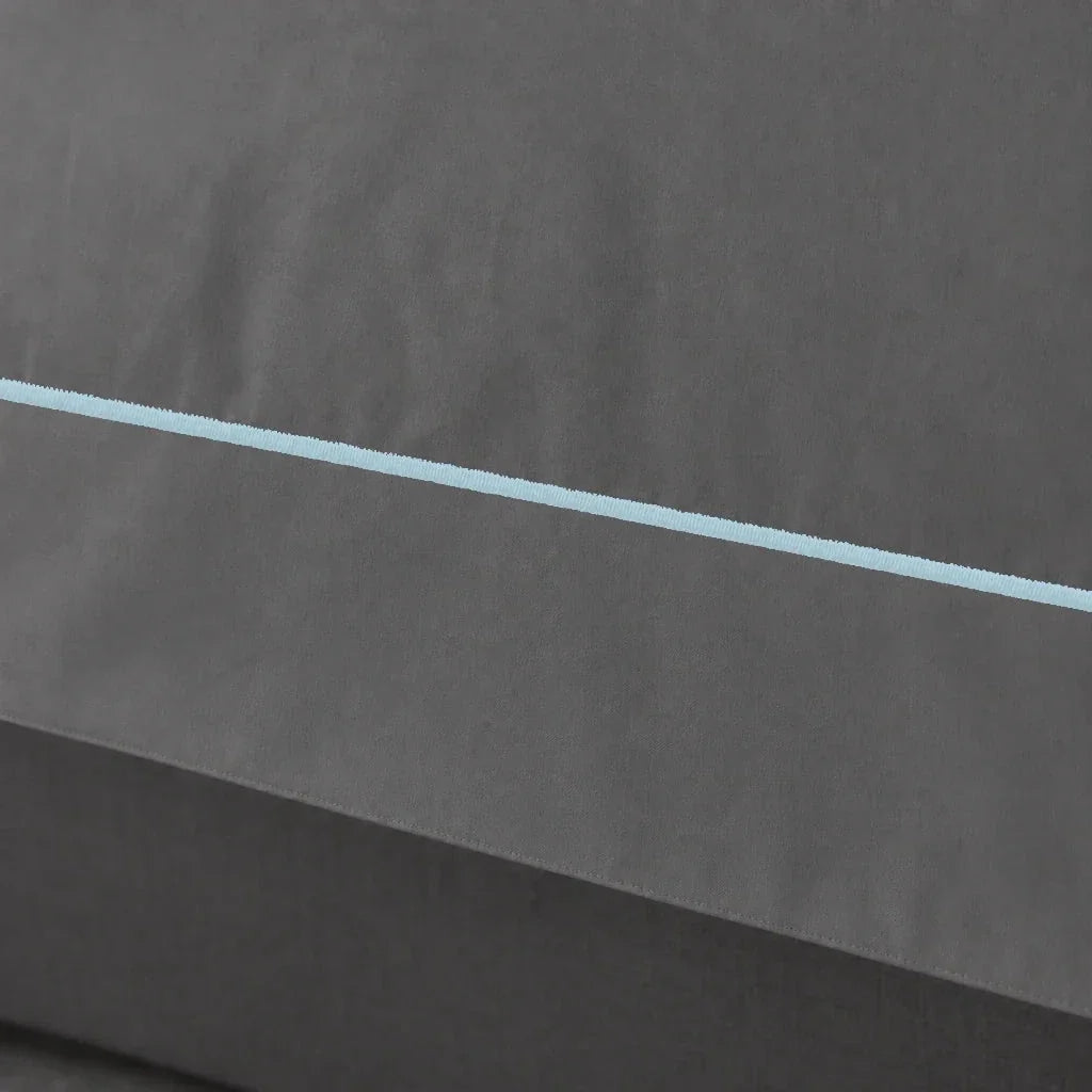 Grey cotton 200TC Oxford duvet cover set with Duck Egg one-row satin stitch – close up view | Linen & Co