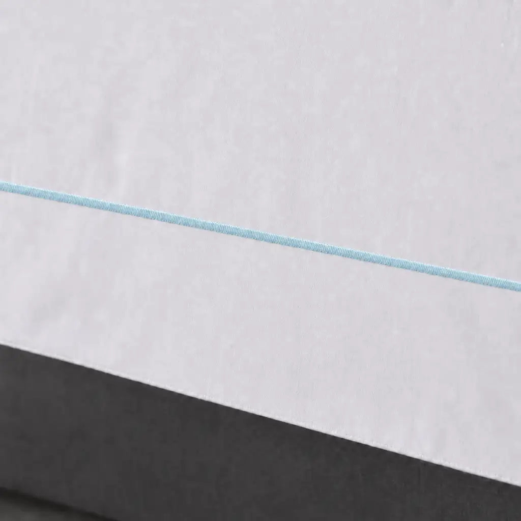 White polycotton percale Oxford duvet cover set with duck egg one-row satin stitch – close-up view | Linen & Co
