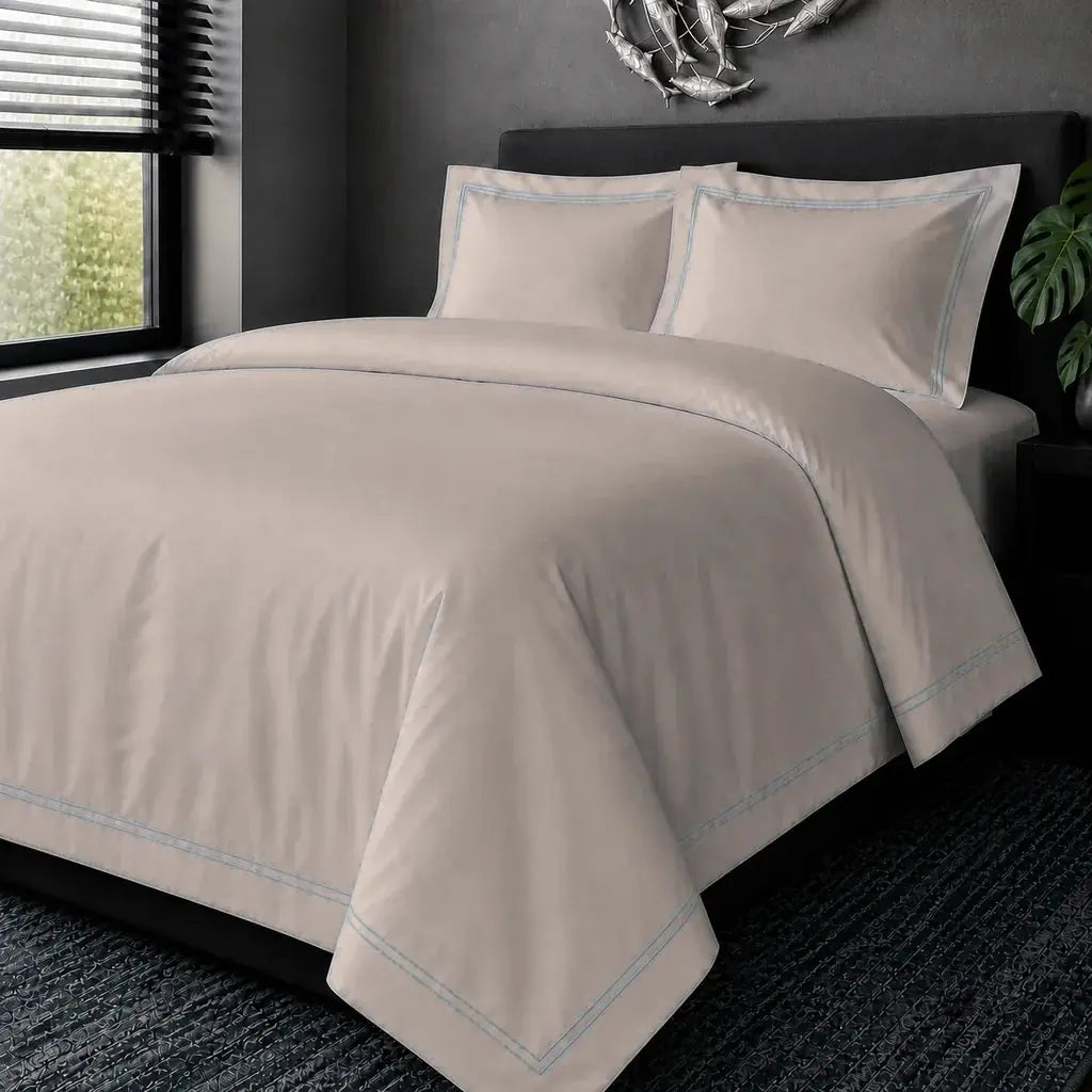 Stone Cotton 200TC Oxford duvet cover set with Duck Egg two-row satin stitch, hero view.