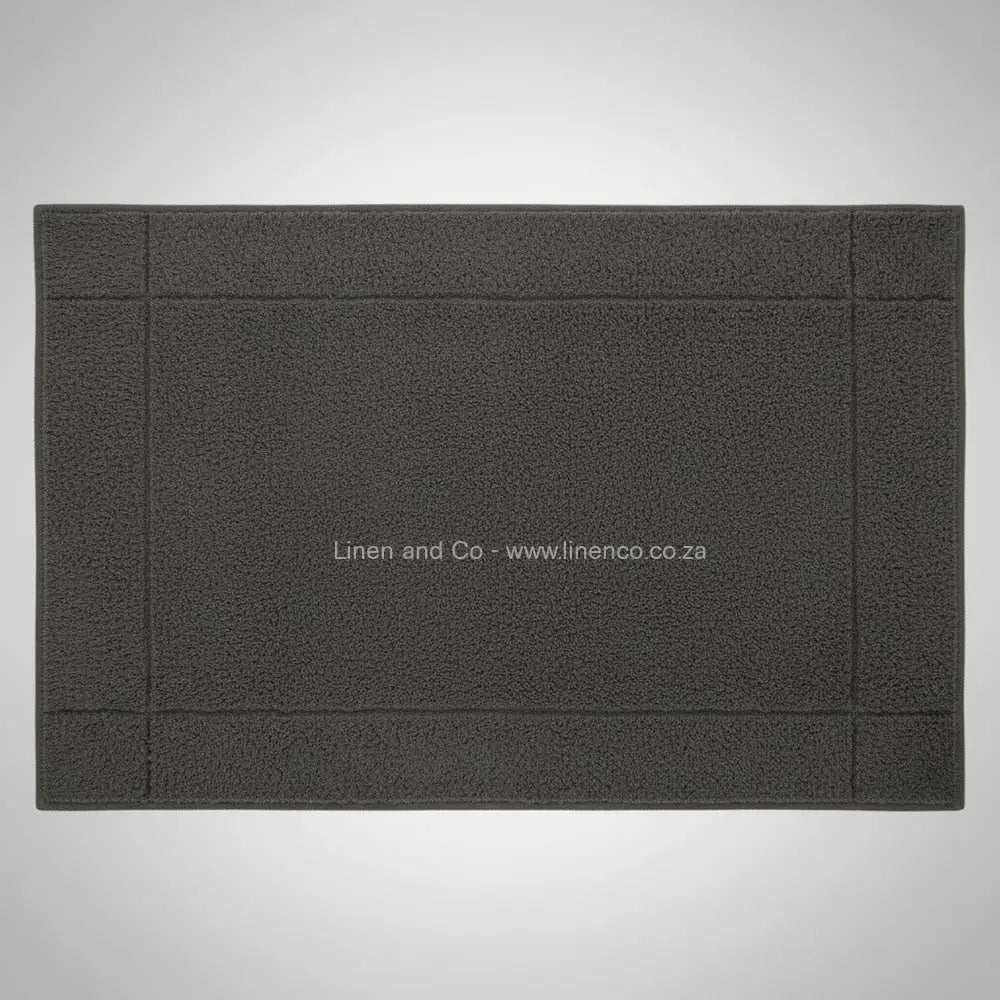High-quality grey bath mat from Linen and Co's Glodina range, illustrating superior absorbency and commercial-grade performance for hospitality environments