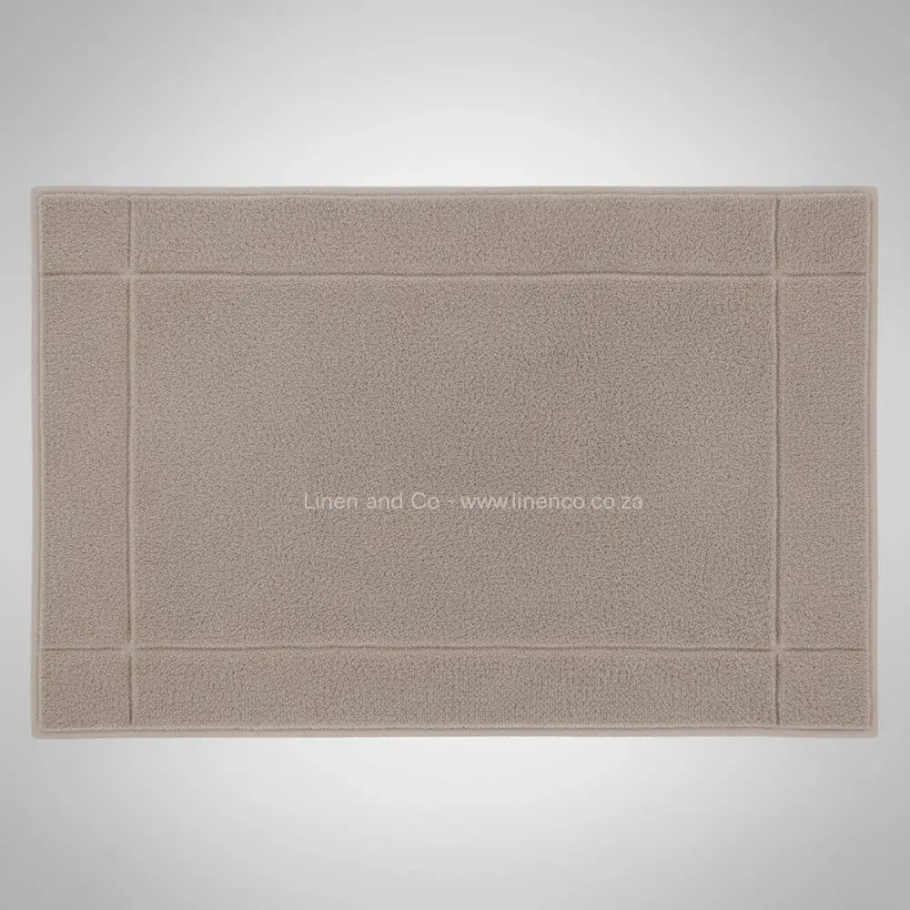 High-quality pebble bath mat from Linen and Co's Glodina range, illustrating superior absorbency and commercial-grade performance for hospitality environments