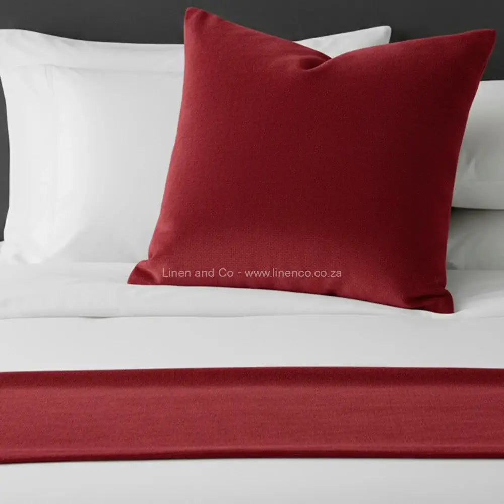 Red-coloured chenille bed end runner and scatter cushion on white bedding - premium hospitality bedding by Linen & Co