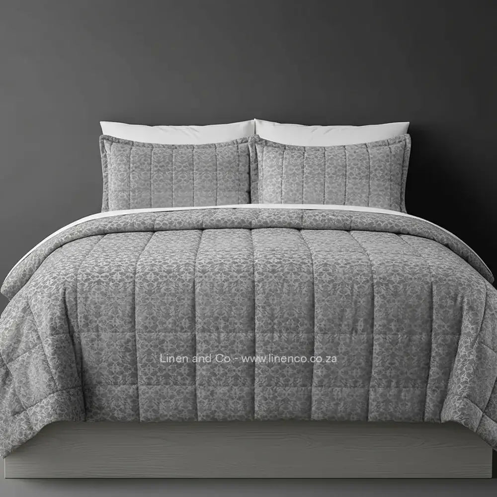 Luxury grey cologne comforter with quilted patterned design displayed on bed, featuring premium neutral tones and elegant texture, hospitality-grade bedding by Linen and Co