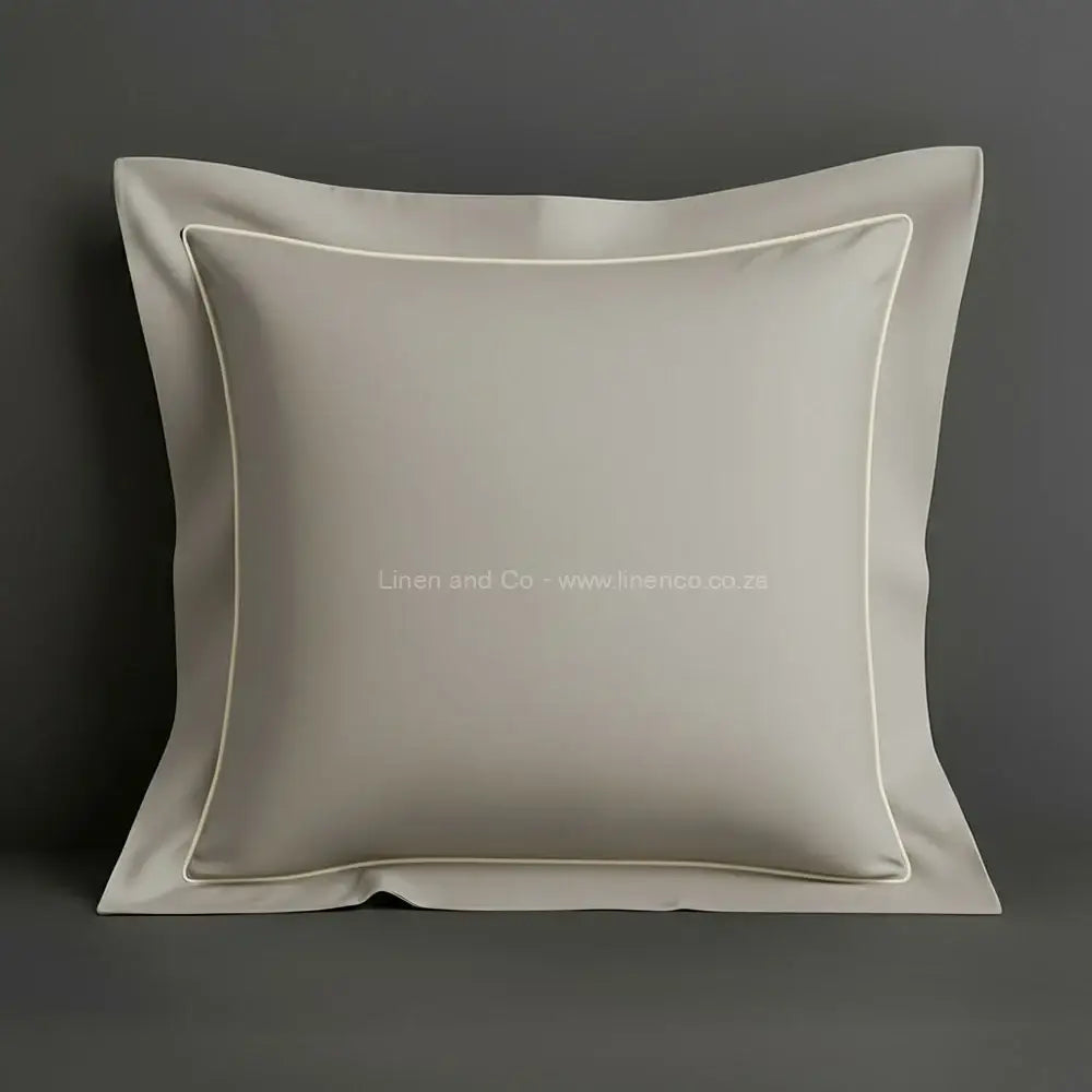 Stone oxford pillow case with one row satin stitch detail on a grey background. Luxury Hotel Linen by Linen and Co.