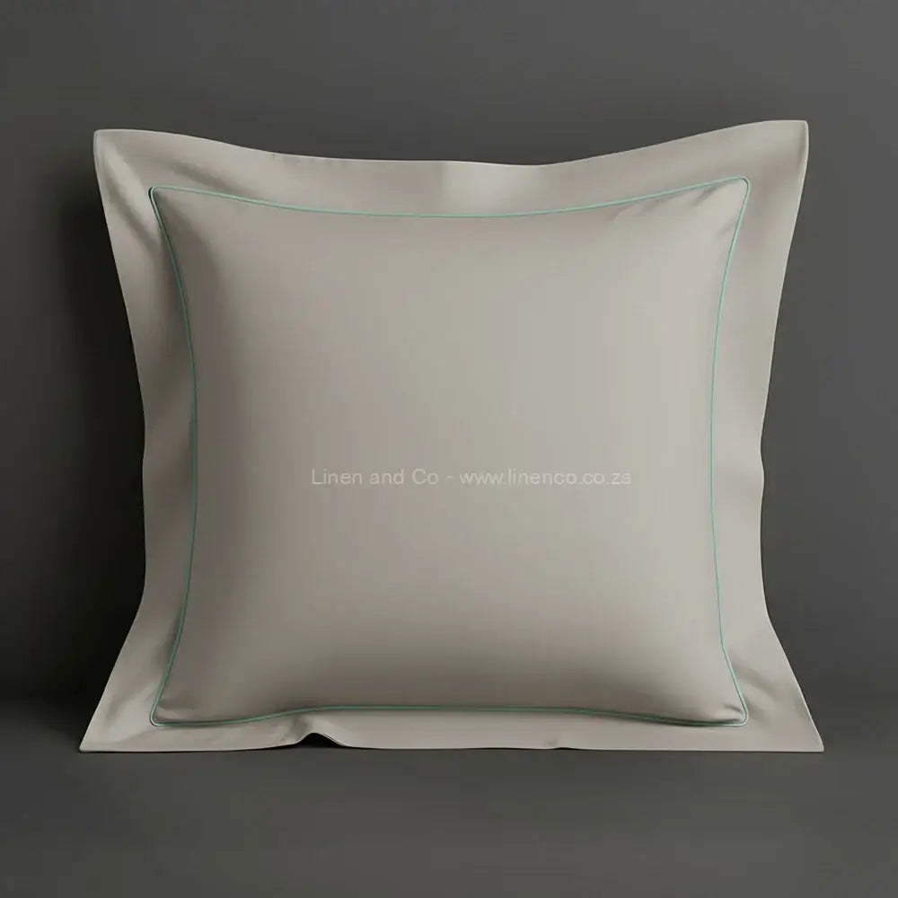 Stone oxford pillow case with one row satin stitch detail on a grey background. Luxury Hotel Linen by Linen and Co.