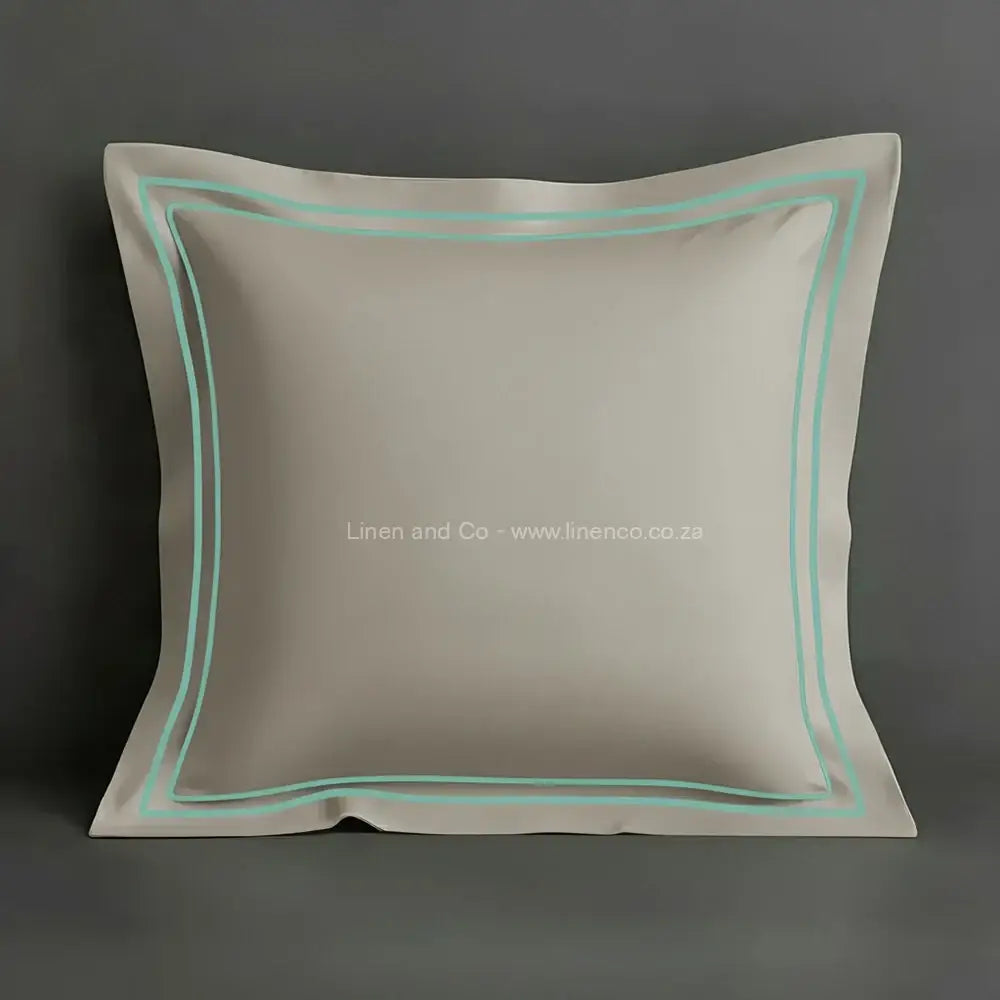 Stone oxford pillow case with two row satin stitch detail on a grey background. Luxury Hotel Linen by Linen and Co.