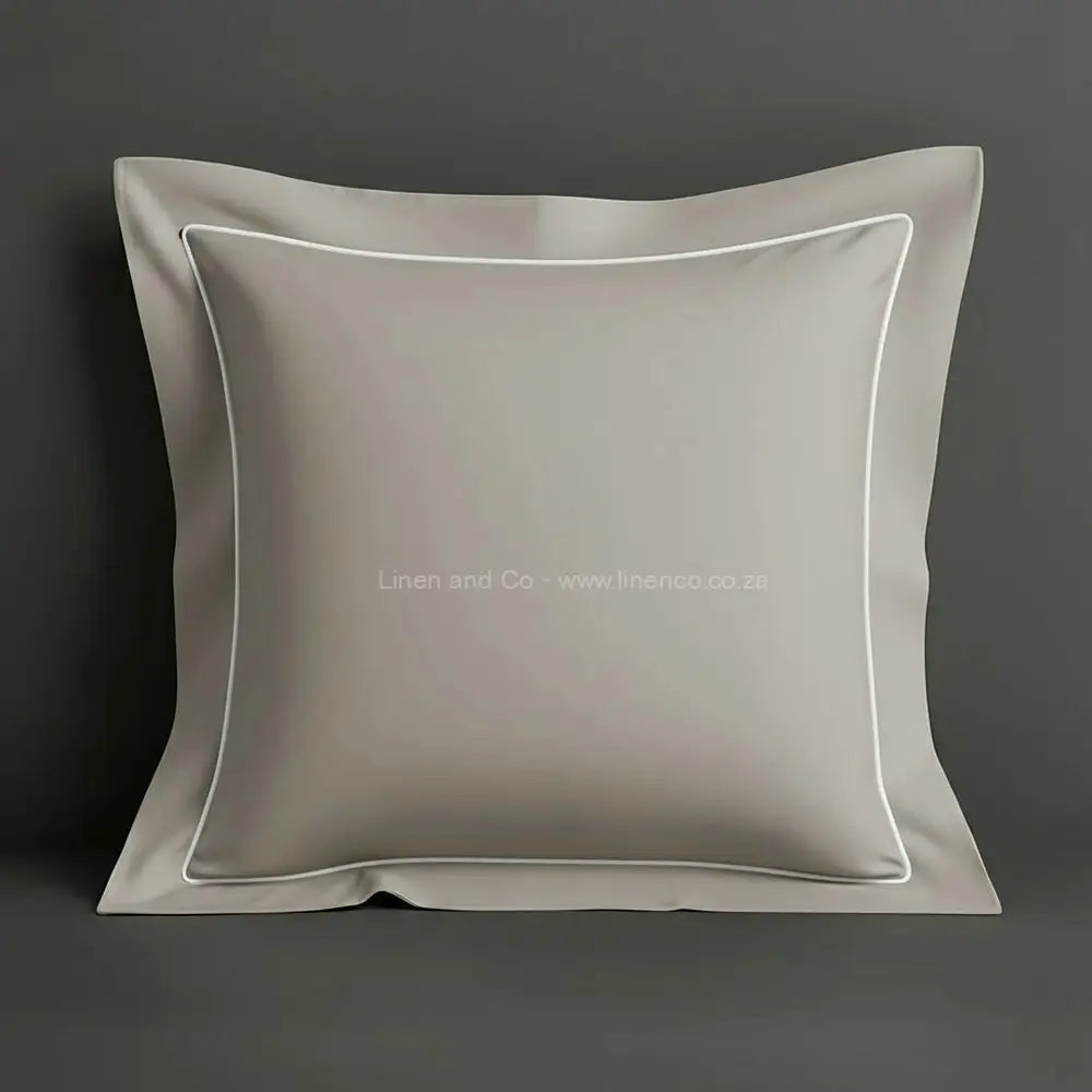 Stone oxford pillow case with one row satin stitch detail on a grey background. Luxury Hotel Linen by Linen and Co.