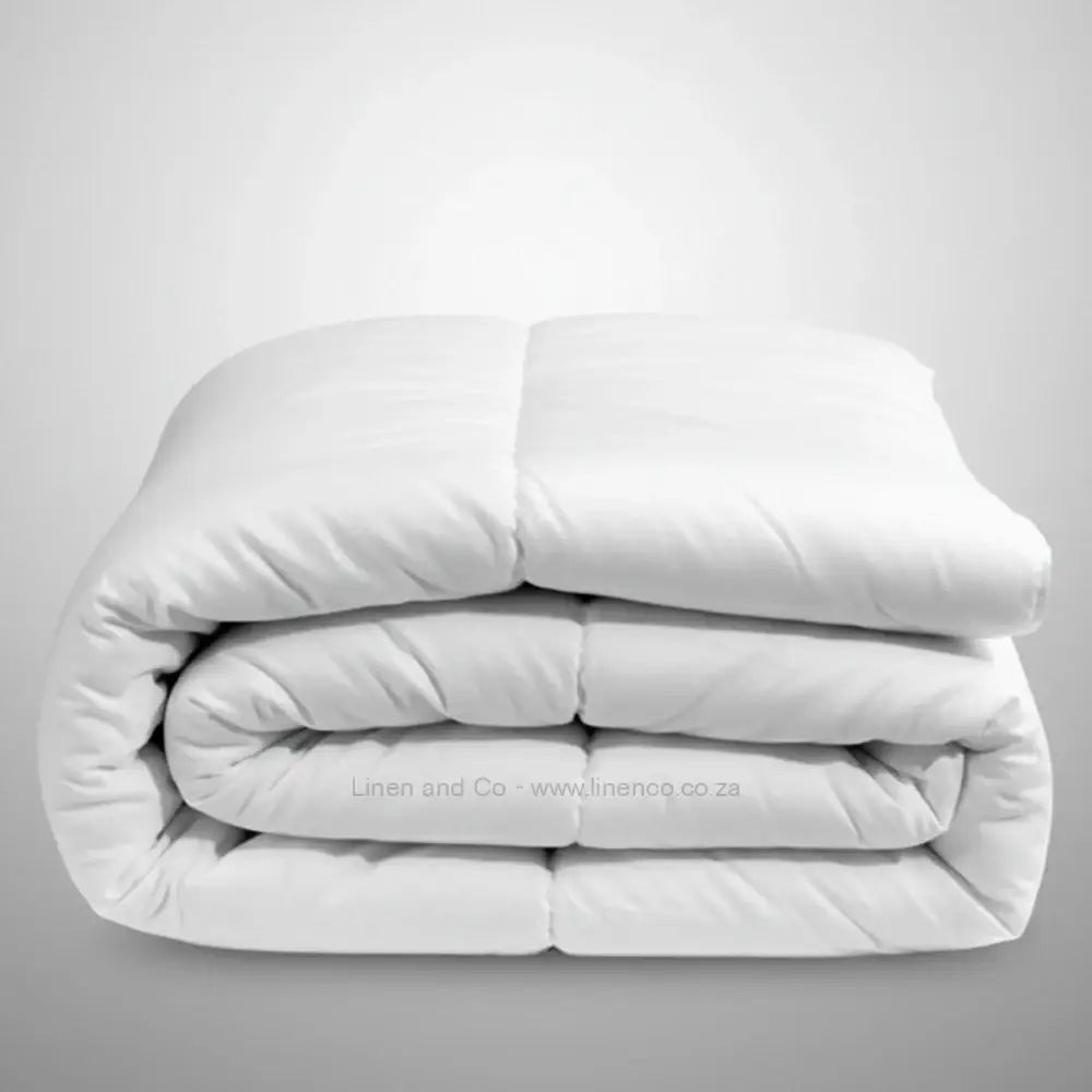 White quilted duvet inner with square pattern - luxury hotel bedding by Linen & Co