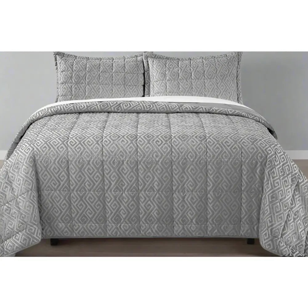 Grey Cambridge design chenille quilt set on a bed with matching pillows.