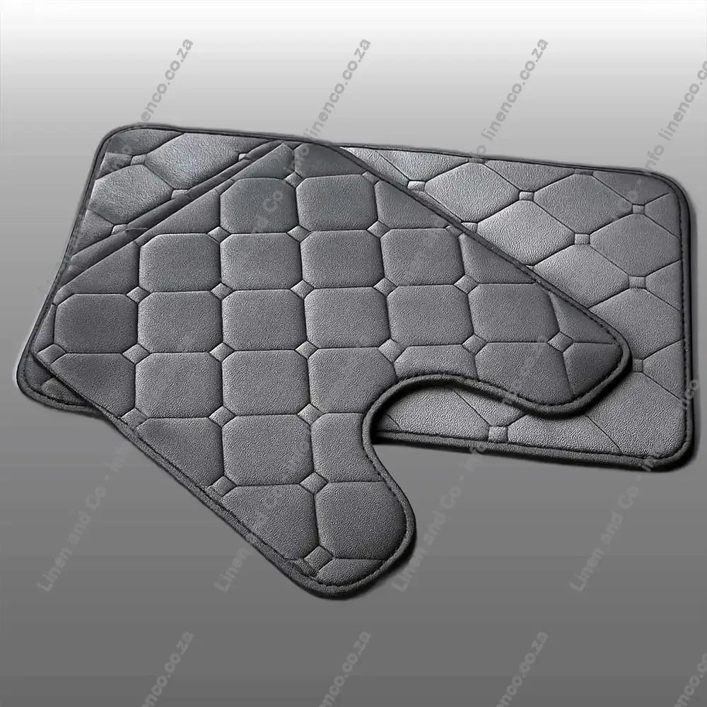 Charcoal Grey Memory Foam bath mat set textured bath mat on a light grey background