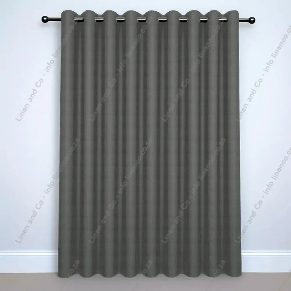 Alloy Eyelet Woven Blockout curtain on a silver curtain rod