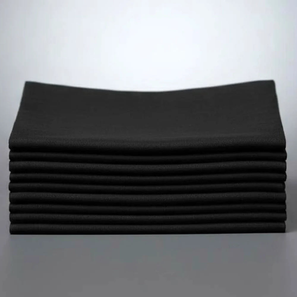 Stack of black napkins on a white background