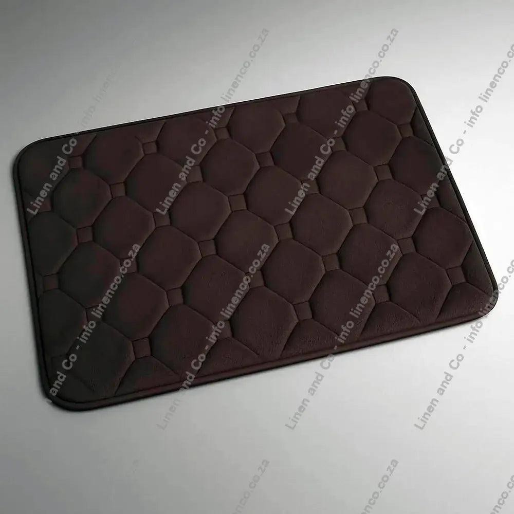 Chocolate Brown Memory Foam textured bath mat on a light grey background