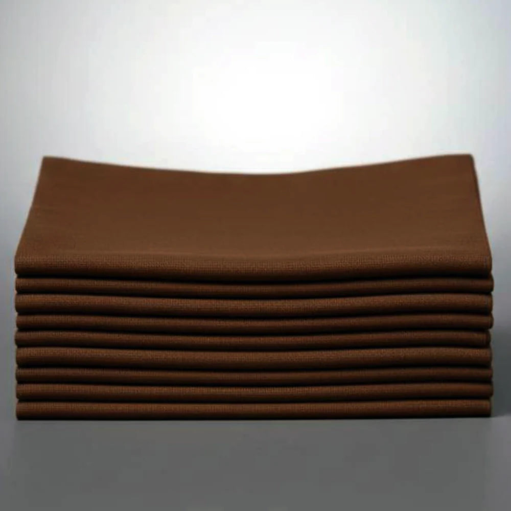 Stack of Chocolate brown napkins on a white background