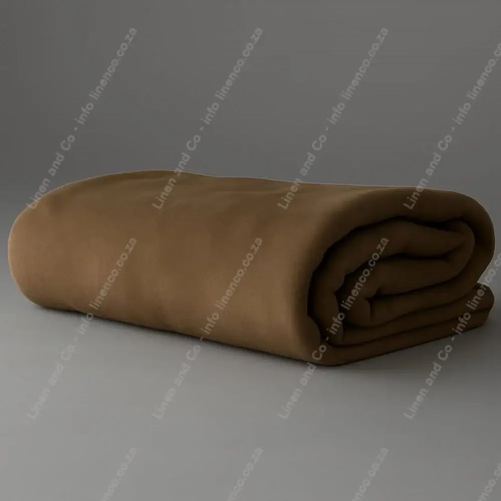 Linen and Co - Cobbelstone Belfiore Hotel Blanket Folded on a Grey Background.