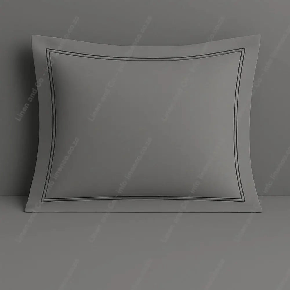 Grey continental pillow case with two row satin stitch on a grey background.
