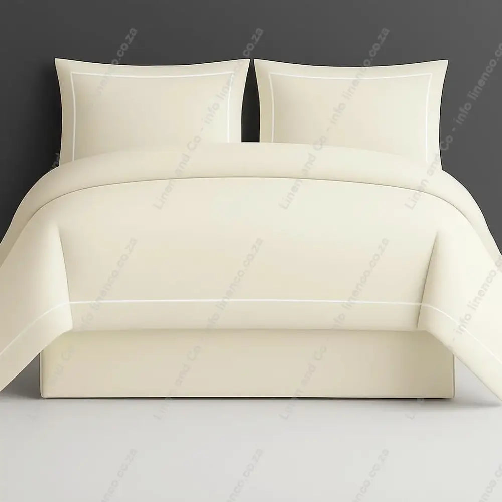Cream Oxford duvet cover with one row satin stitch with a grey a grey 