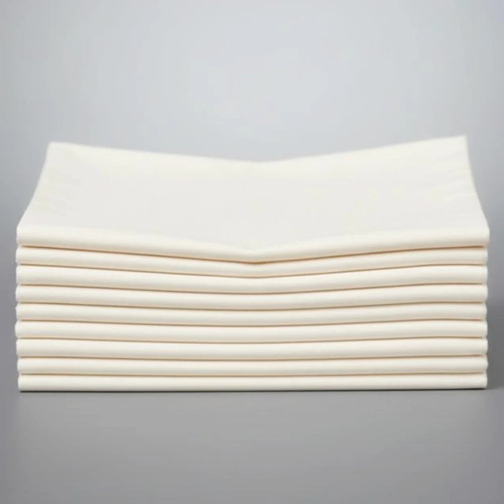 Stack of cream napkins on a white background