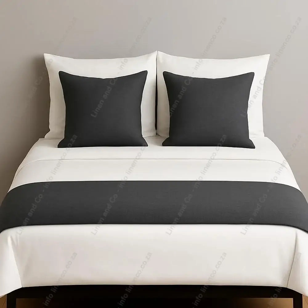 Linen and Co Dark Grey decorative bed end runner with matching scatter pillows on white linen with a grey background
