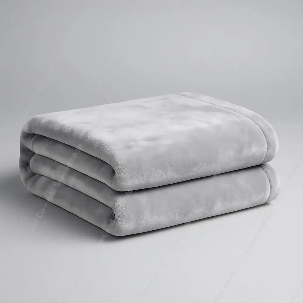Linen and Co Dove Grey Luxury Plush 
Blanket on a Grey Background.