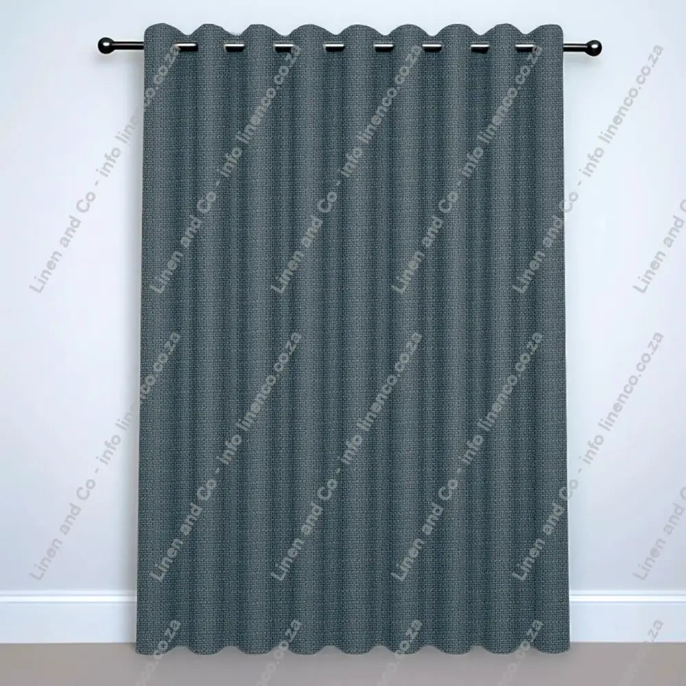 Duck Egg Eyelet curtain on a silver rod with silver ball finials.