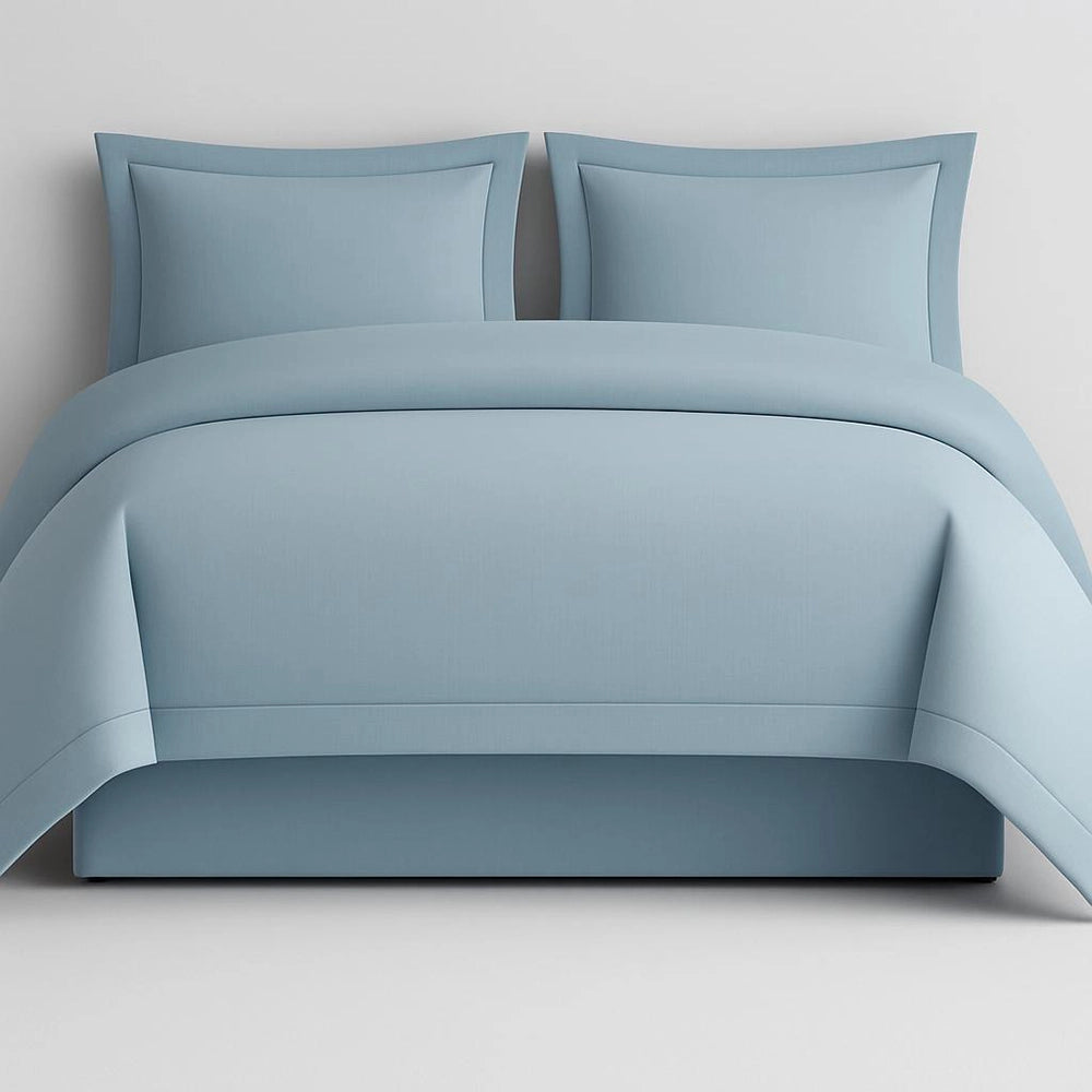 Linen and Co Duck Egg Oxford 1 Row Satin Stitch Duvet Cover with matching Pillow Cases on a Grey background.