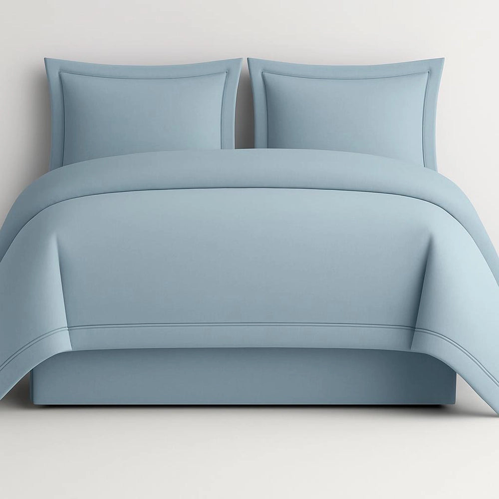 Linen and Co Duck Egg Oxford 2 Row Satin Stitch Duvet Cover with matching Pillow Cases on a Grey background.