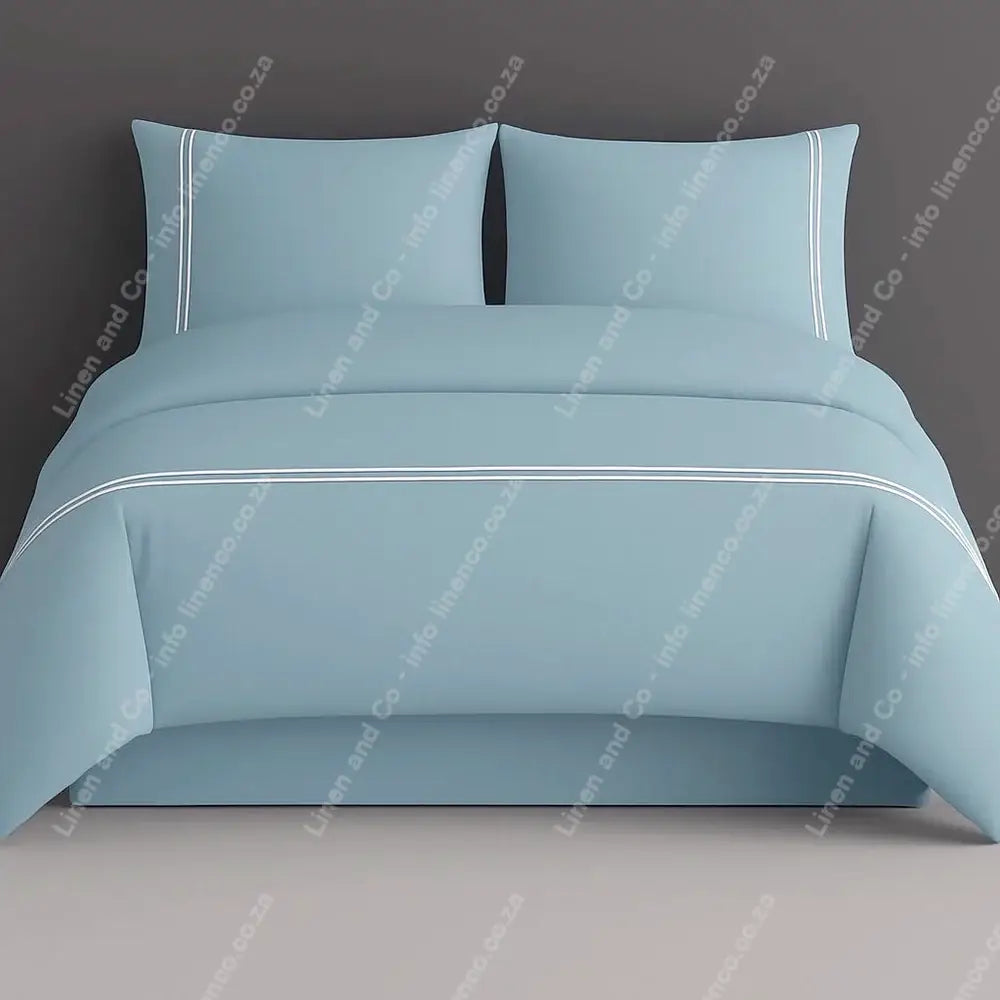 duck egg plain duvet cover set with white two row satin stitch on a grey background
