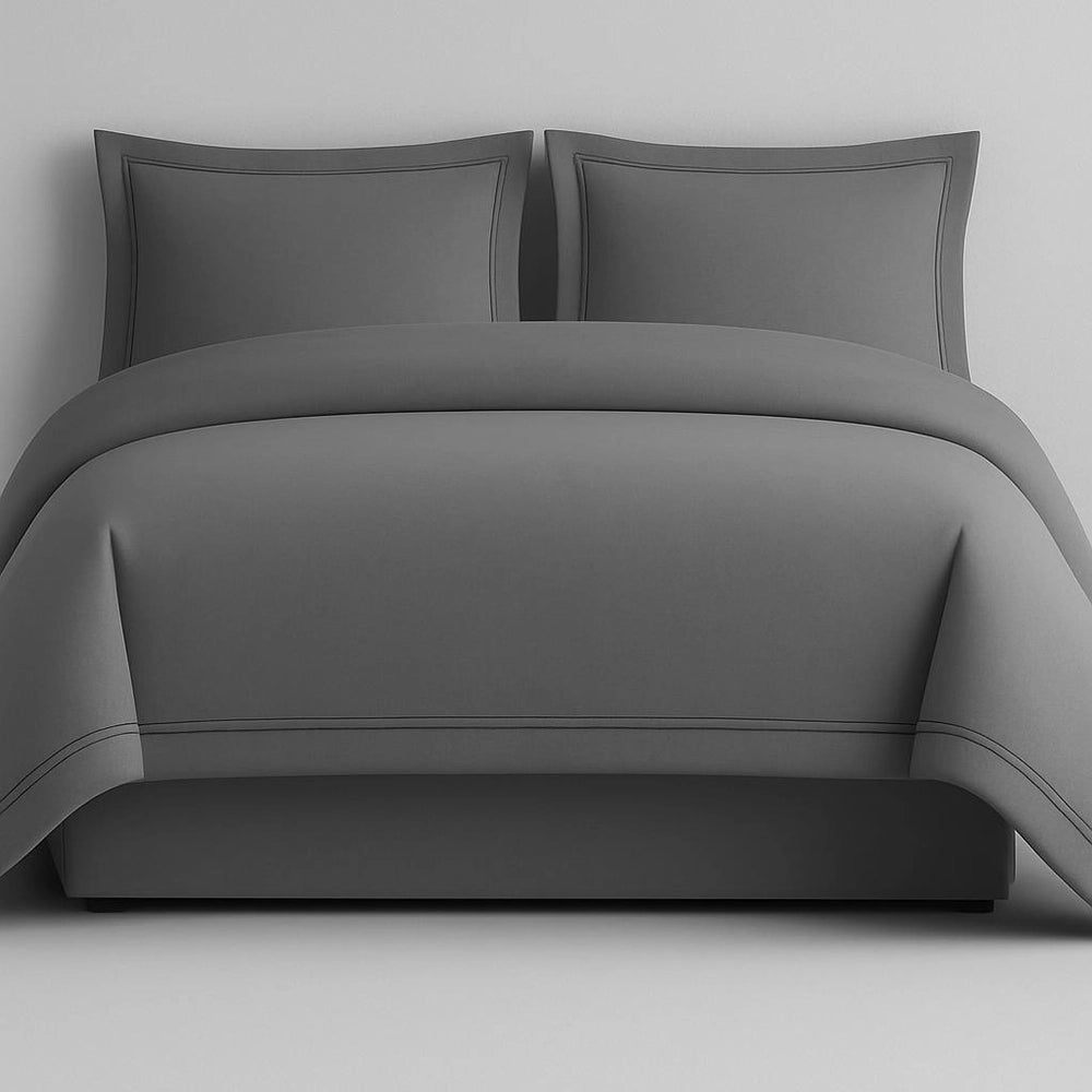 Linen and Co Grey Oxford 2 Row Satin Stitch Duvet Cover with matching Pillow Cases on a Grey background.