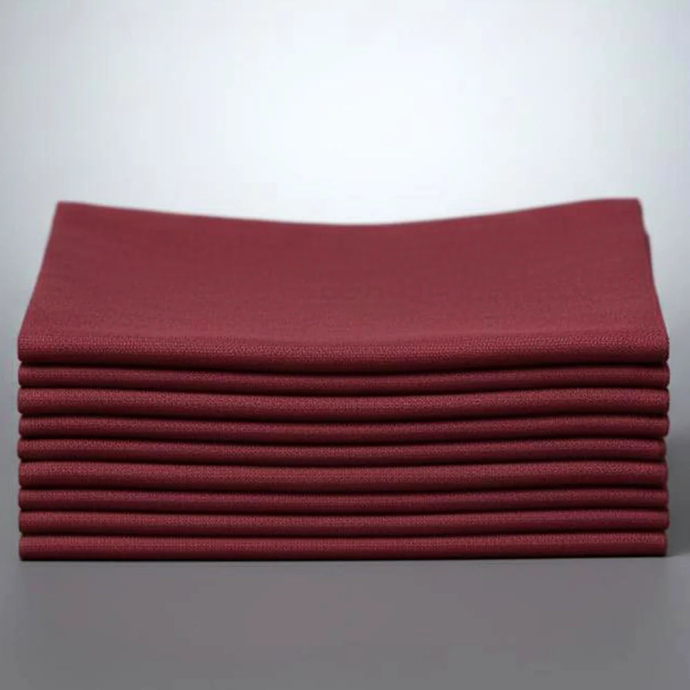 Stack of maroon napkins on a white background