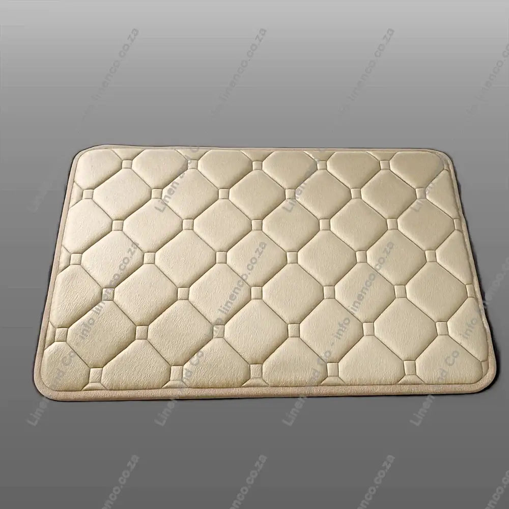 Natural Memory Foam textured bath mat on a light grey background