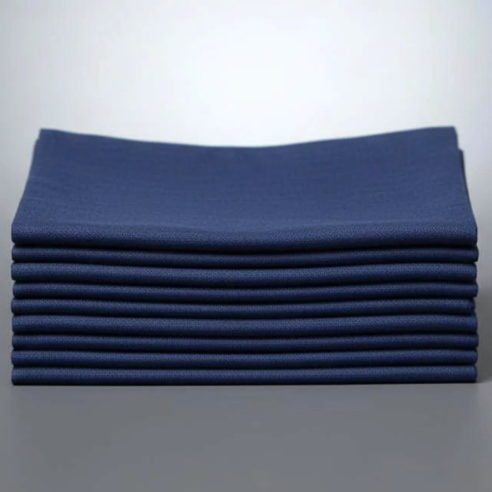 Stack of navy bluer napkins on a white background