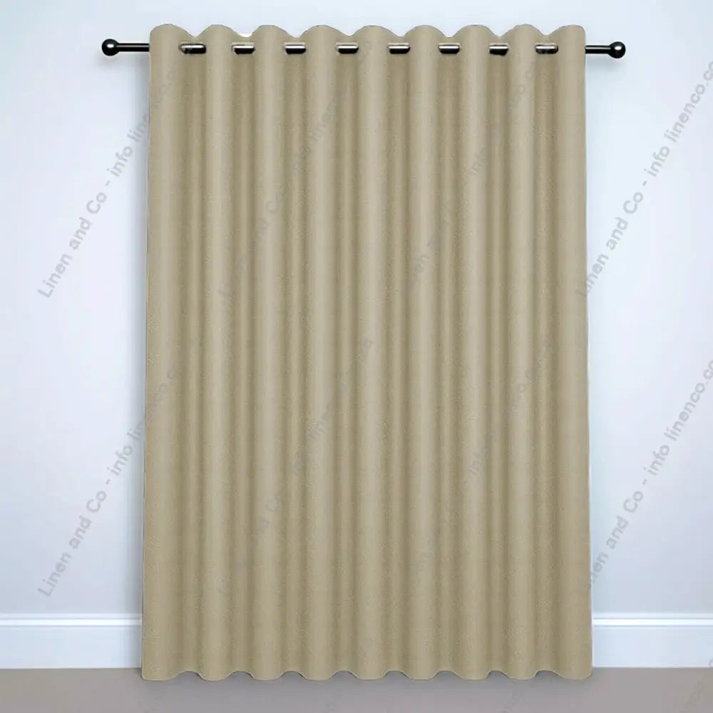 Oyster Eyelet Woven Blockout curtain on a silver curtain rod