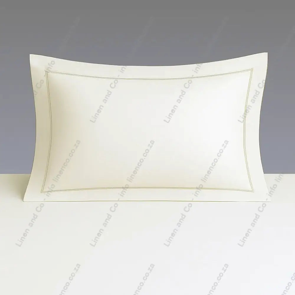 Cream Pillow Case Oxford one Row Satin Stitch on a grey background.
