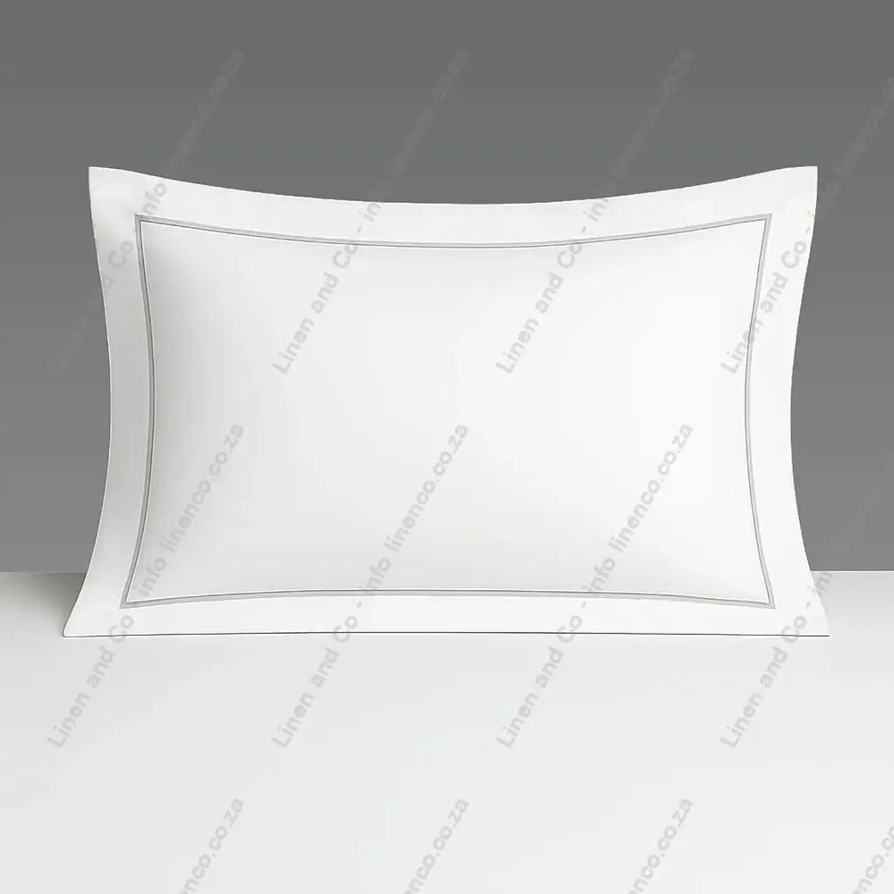 White Pillow Case Oxford one Row Satin Stitch on a grey background.
