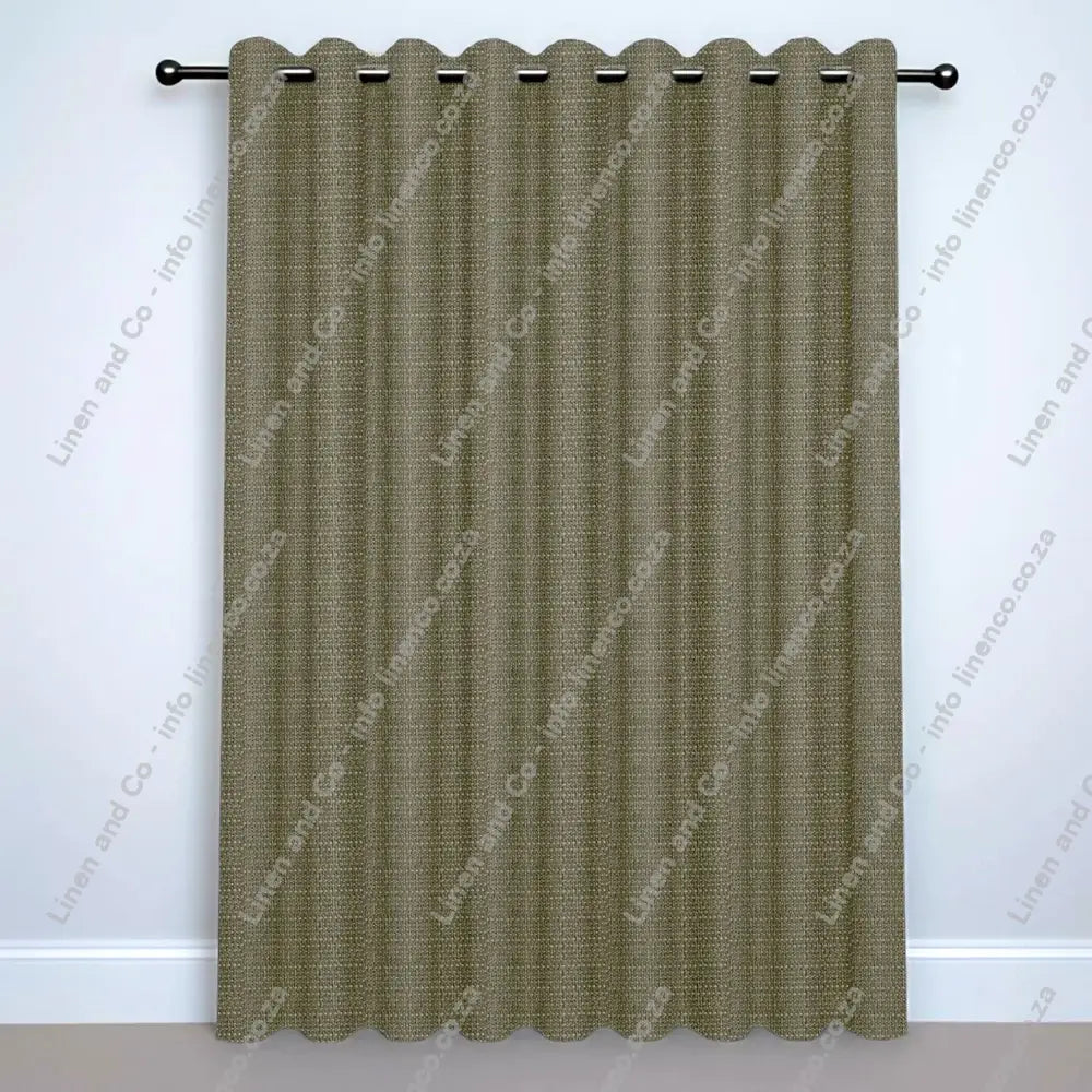 Sand Eyelet curtain on a silver rod with silver ball finials.