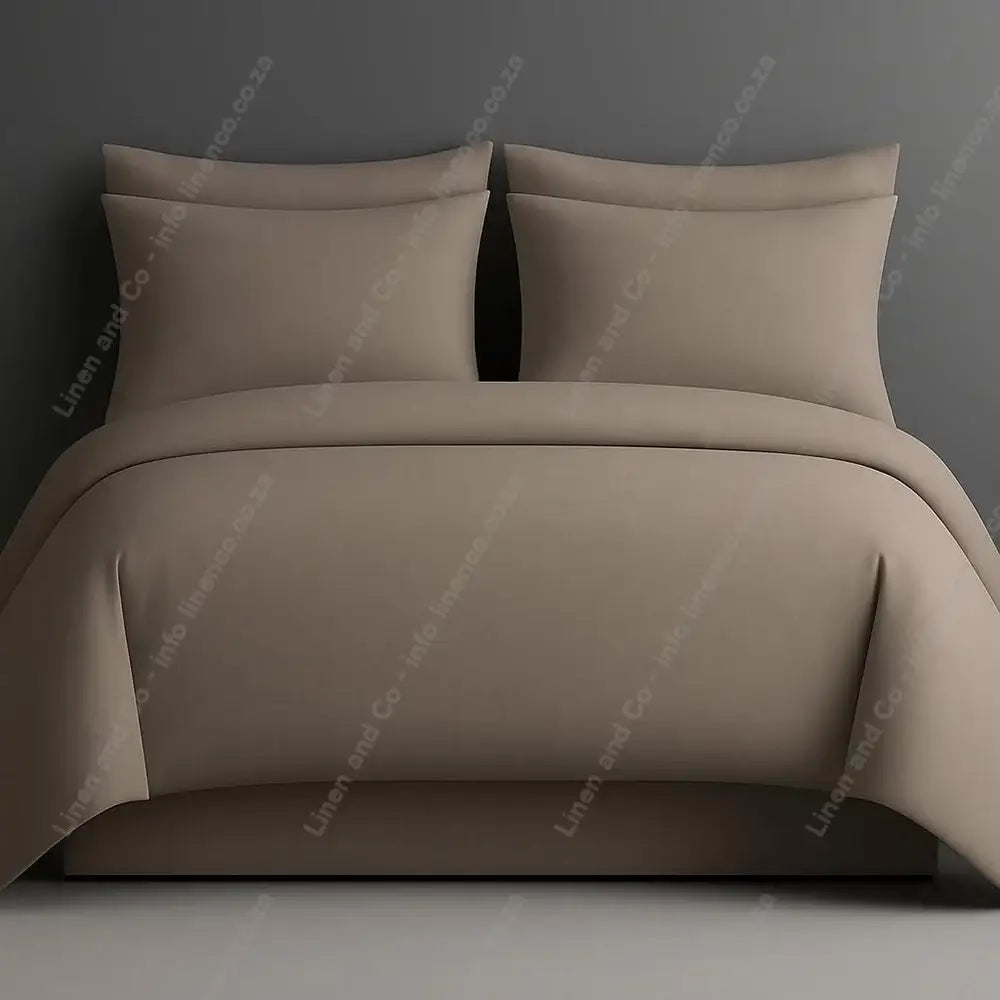 Plain style duvet cover stone with matching pillow cases on a grey background.