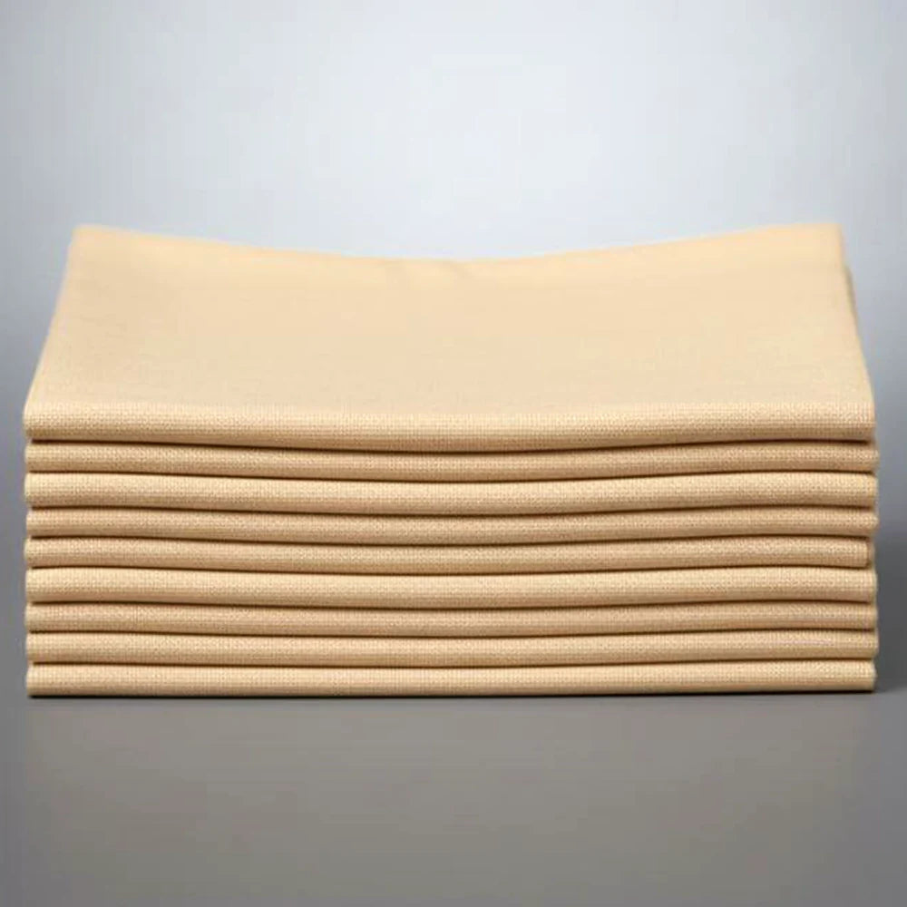 Stack of tan napkins on a white background