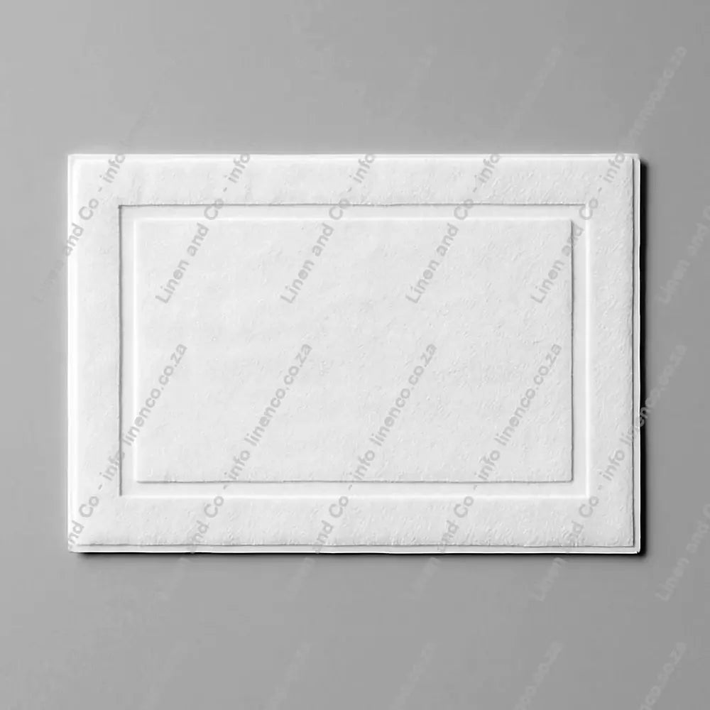 White rectangular bath mat on a gray background