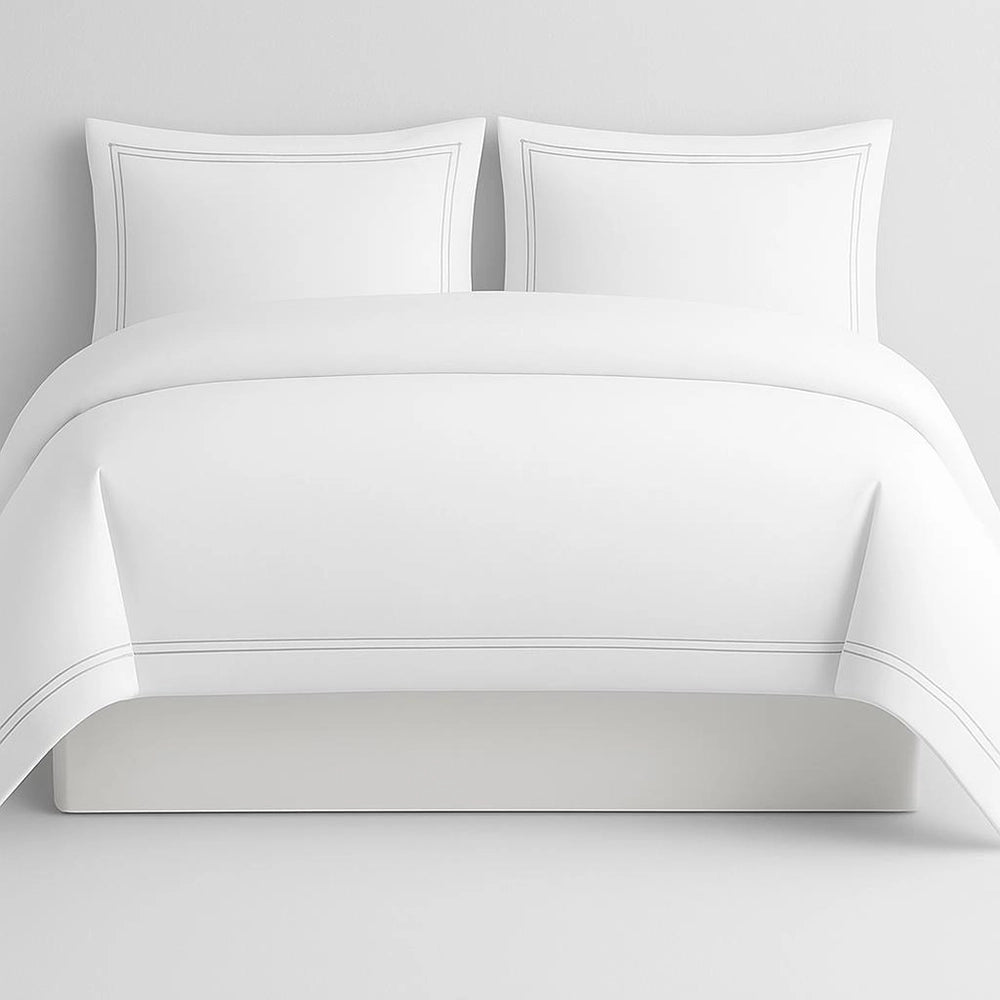 Linen and Co White Oxford 2 Row Satin Stitch Duvet Cover with matching Pillow Cases on a Grey background.