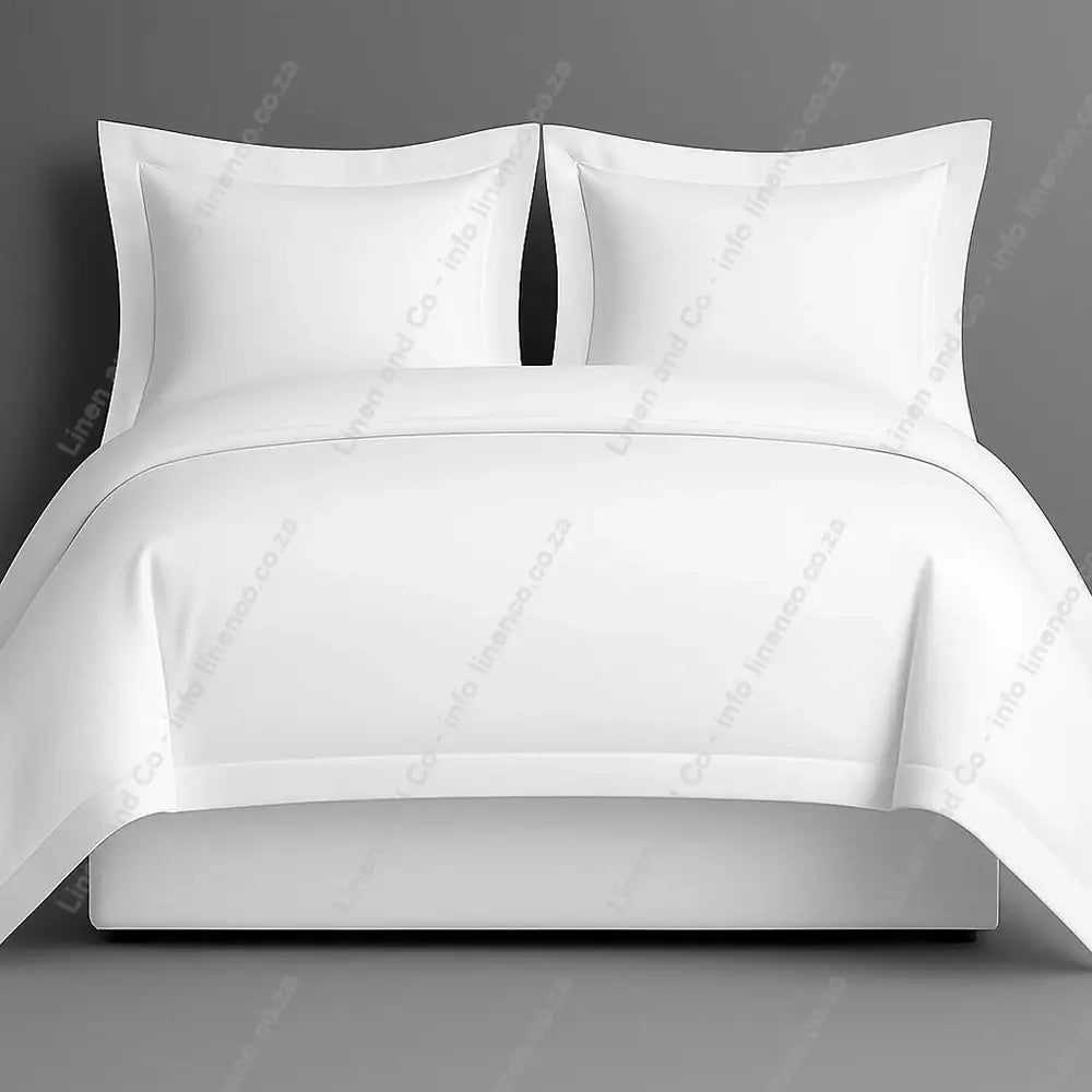 White oxford bedding set with two pillows on a grey background