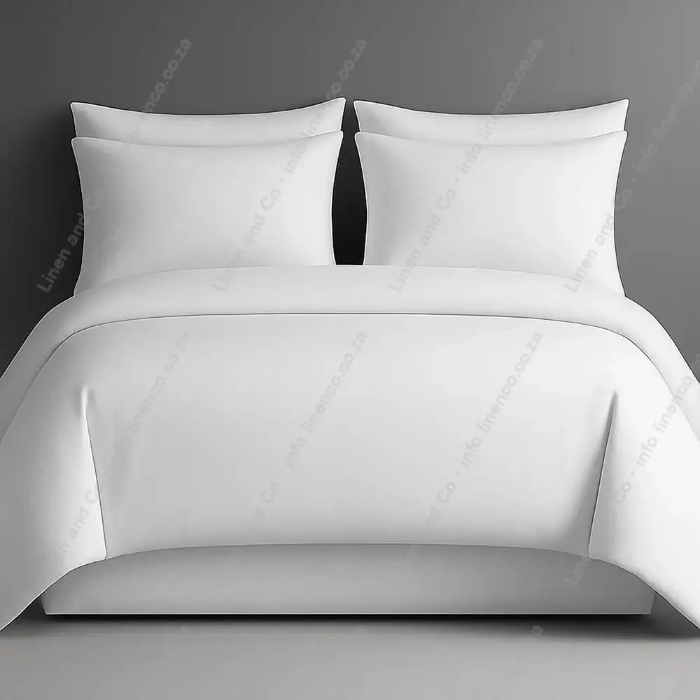Plain style duvet cover white with matching pillow cases on a grey background.