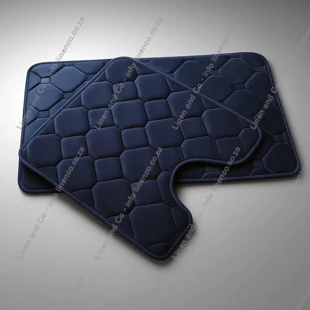 Navy Blue Memory Foam bath mat set textured bath mat on a light grey background