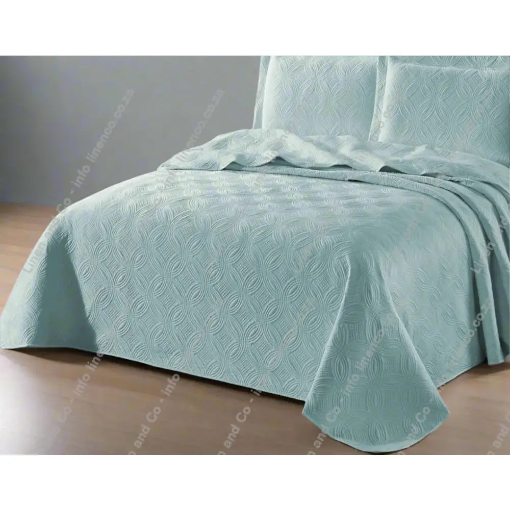 Marine Munich design quilted bedspread textured bedspread on a bed. 