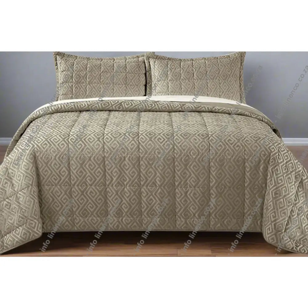Natural Cambridge design chenille quilt set on a bed with matching pillows.