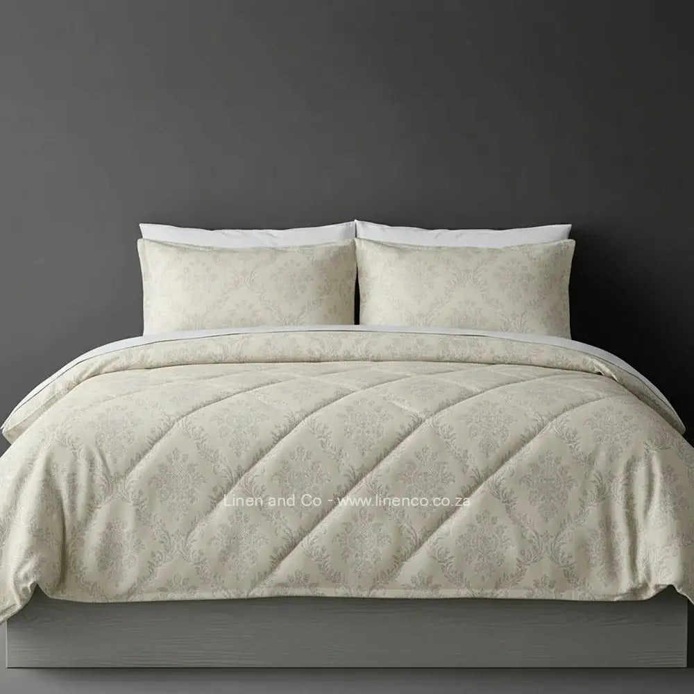 Luxury natural Brisbane comforter with quilted patterned design displayed on bed, featuring premium neutral tones and elegant texture, hospitality-grade bedding by Linen and Co