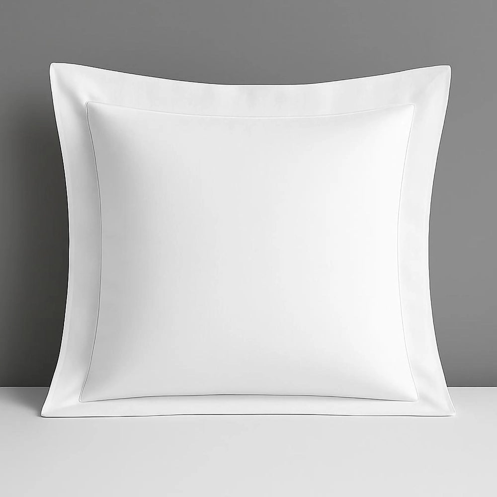 White Oxford continental pillow case in polycotton percale, featuring 200 thread count and classic Oxford border styling. Luxurious hospitality-grade pillowcase designed for premium hotels and elegant home bedrooms. Crisp white finish with refined textile craftsmanship.